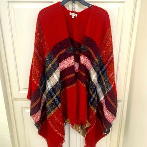 Beautiful fringed wrap with closure hook.